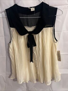 Passport Sleeveless Pleated Tie-Front Blouse in Cream and Black